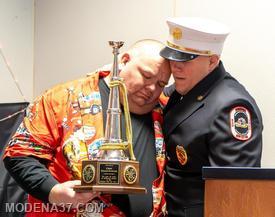 Chief is an emotional guy, hugging his son after being presented his award